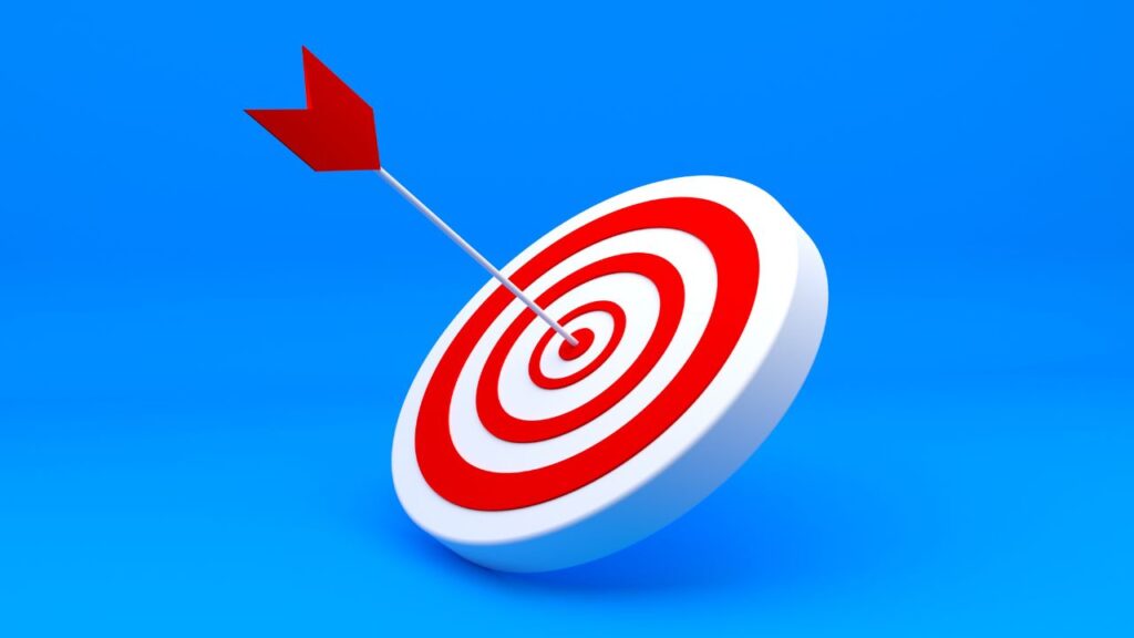 Obrazek przedstawia tarcze i rzutkę w samym jej środku